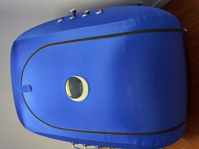 Patient receiving hyperbaric oxygen therapy treatment